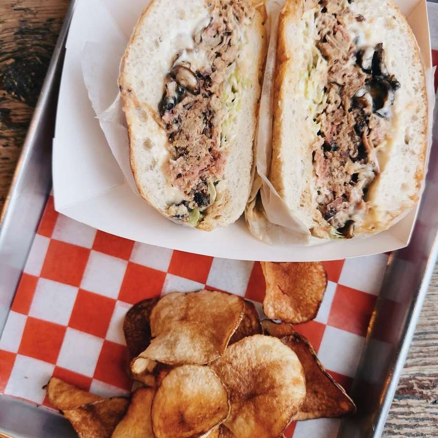 Maczanka — Kraków-style pulled meat sandwich with house chips at Spoko