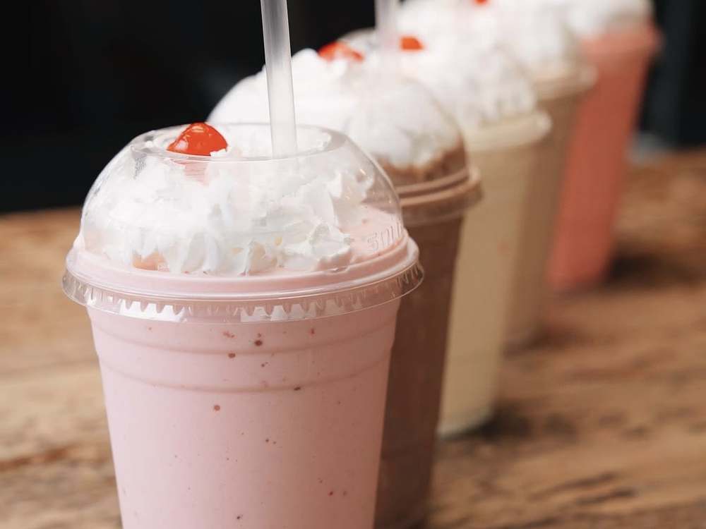 Hand-spun milkshakes with whipped cream and cherries at Spoko Lincoln Park