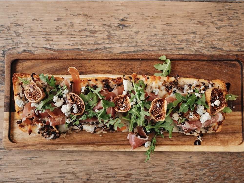 Zapiekanka with figs, prosciutto, blue cheese and arugula at Spoko Lincoln Park